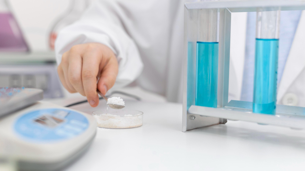 Editorial pharma image — powder on balance